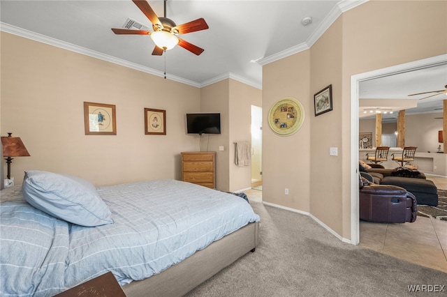 bedroom featuring light carpet, baseboards, visible vents, and ornamental molding