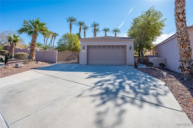 garage with a gate and fence