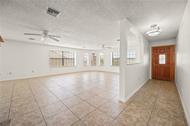 2218 Family Cir, Bullhead City, AZ 86442 - foyer entrance with a ceiling fan, light tile patterned floors, and a textured ceiling