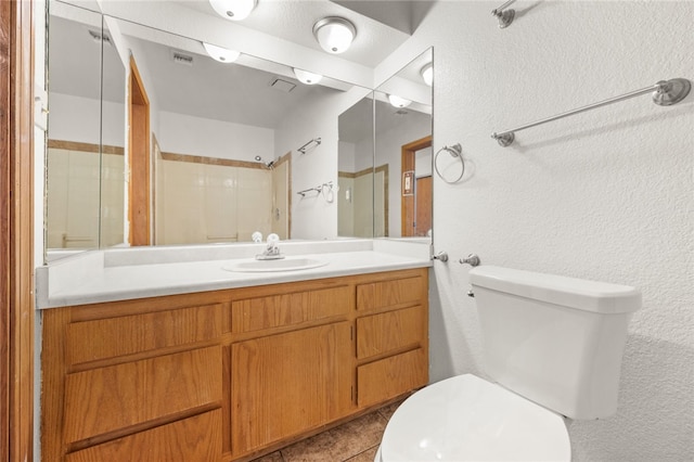 2218 Family Cir, Bullhead City, AZ 86442 - bathroom with vanity, a textured wall, tile patterned floors, and a shower