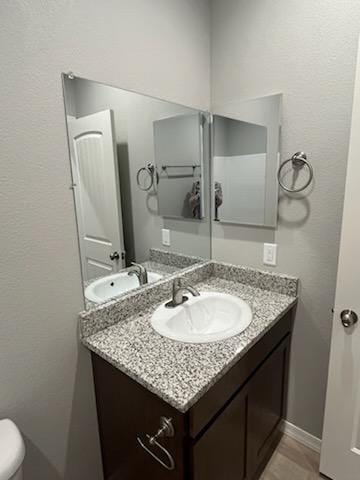 3521 E Lum Ave, Kingman, AZ 86409 - half bathroom with vanity and toilet