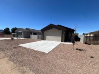 3521 E Lum Ave, Kingman, AZ 86409 - ranch-style home with concrete driveway and an attached garage