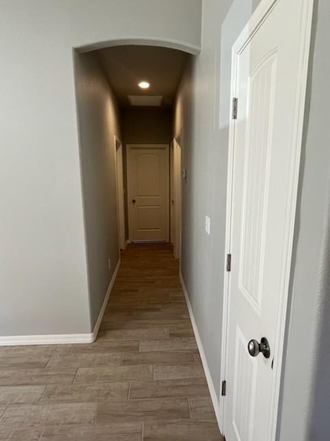 3521 E Lum Ave, Kingman, AZ 86409 - corridor with arched walkways, light wood-style floors, baseboards, and recessed lighting