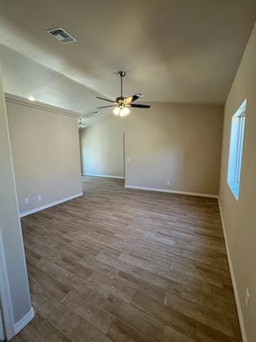 3521 E Lum Ave, Kingman, AZ 86409 - unfurnished room featuring baseboards, ceiling fan, wood finished floors, and lofted ceiling