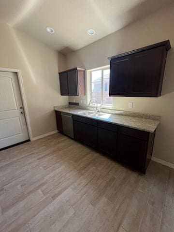 3521 E Lum Ave, Kingman, AZ 86409 - kitchen with stainless steel dishwasher, a sink, baseboards, light wood-type flooring, and recessed lighting