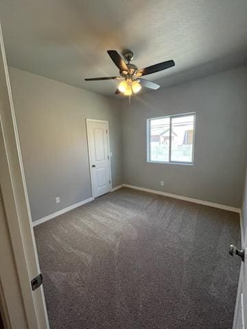 3521 E Lum Ave, Kingman, AZ 86409 - carpeted spare room featuring baseboards and a ceiling fan