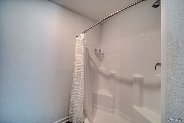 full bathroom with a stall shower