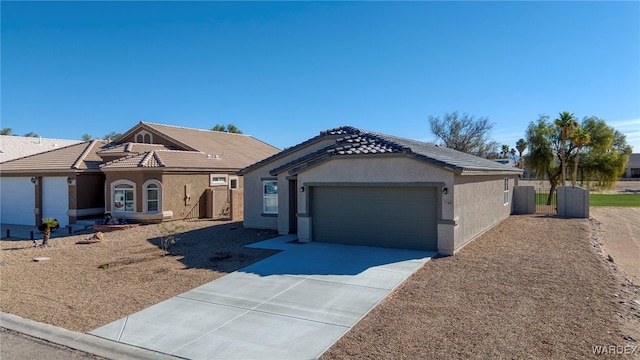 ranch-style home with a garage, stucco siding, concrete driveway, and a tiled roof