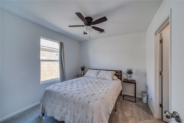 bedroom with baseboards, a ceiling fan, and light colored carpet