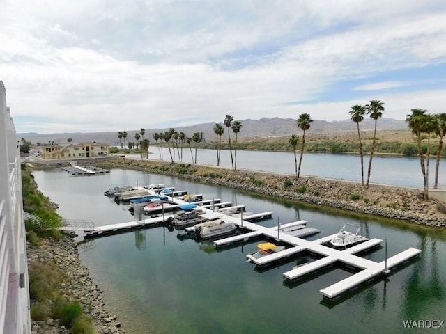 view of dock featuring a water and mountain view