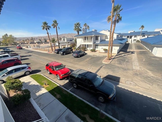 uncovered parking lot with a residential view