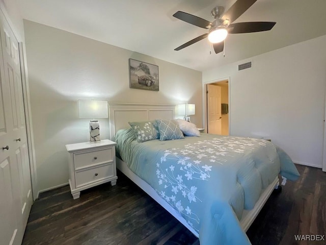 bedroom featuring ceiling fan, dark wood-type flooring, and visible vents