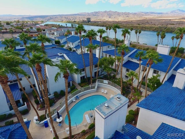 birds eye view of property with a residential view and a water and mountain view