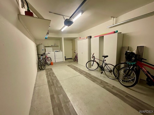 garage featuring a garage door opener and independent washer and dryer