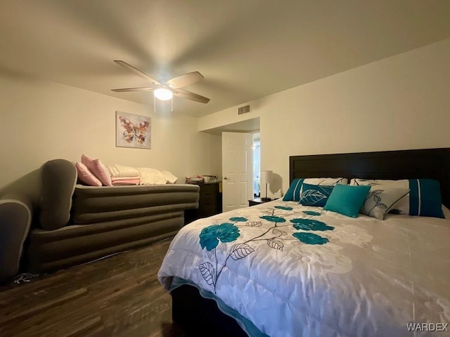 bedroom with dark wood-type flooring, visible vents, and a ceiling fan