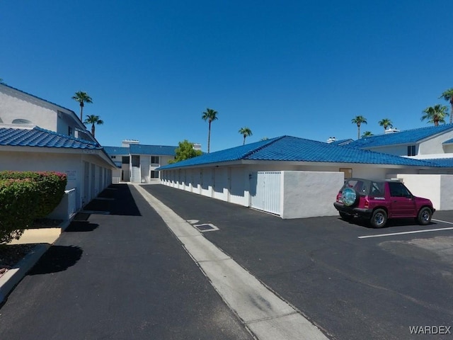 view of street featuring community garages