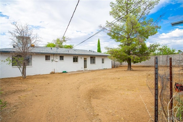 back of property with fence