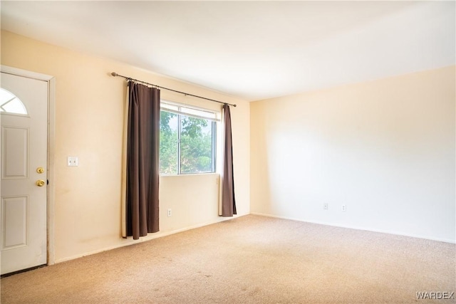 empty room with light colored carpet