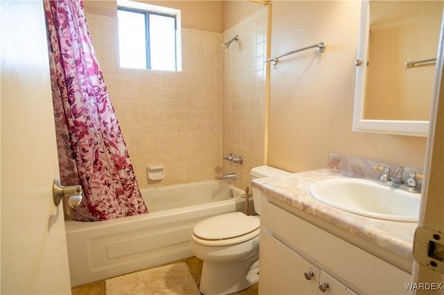 full bath featuring toilet, shower / bath combination with curtain, and vanity