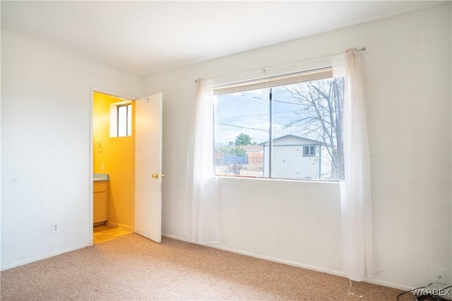 unfurnished bedroom featuring light colored carpet