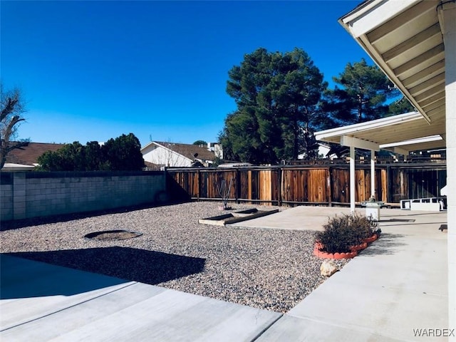 view of yard featuring a fenced backyard and a patio