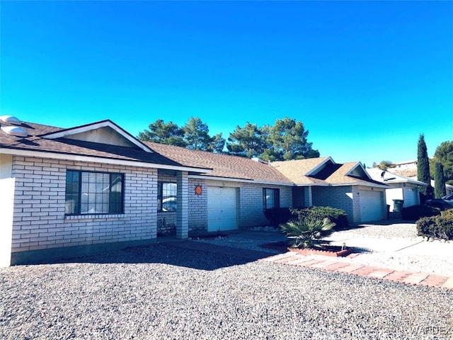 ranch-style house with brick siding and an attached garage