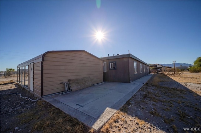 view of side of property featuring a mountain view