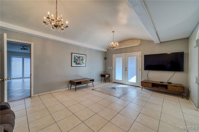 unfurnished living room featuring a chandelier, a wealth of natural light, french doors, and light tile patterned floors