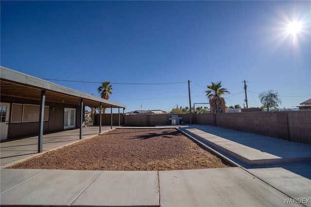 view of yard with a patio area and a fenced backyard