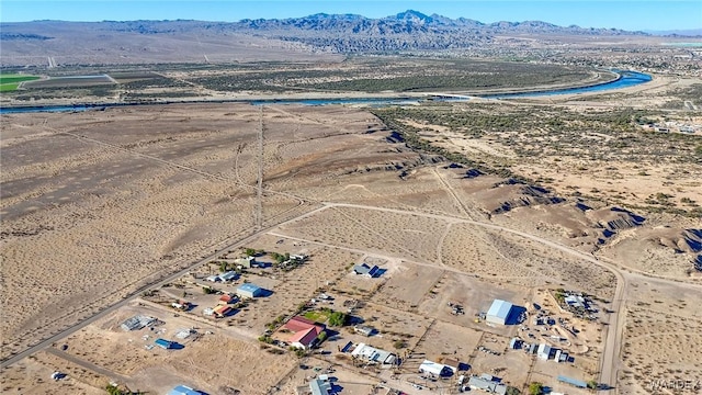 bird's eye view with a mountain view and a desert view