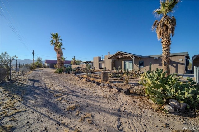 view of front of house with fence