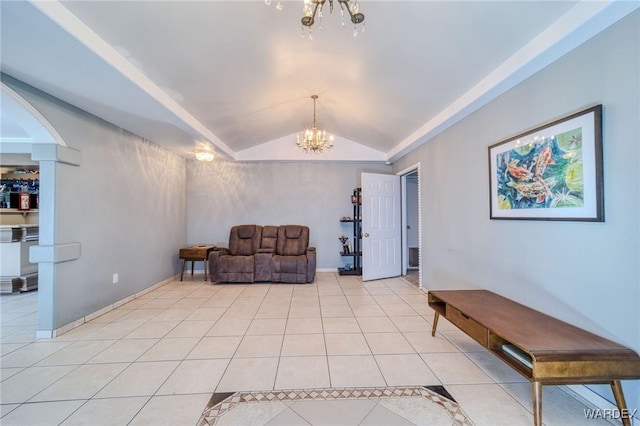 sitting room with baseboards, vaulted ceiling, a notable chandelier, and light tile patterned flooring