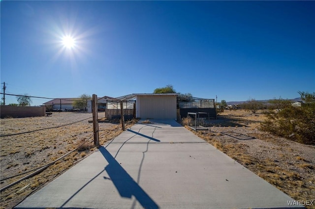 view of front of home featuring fence