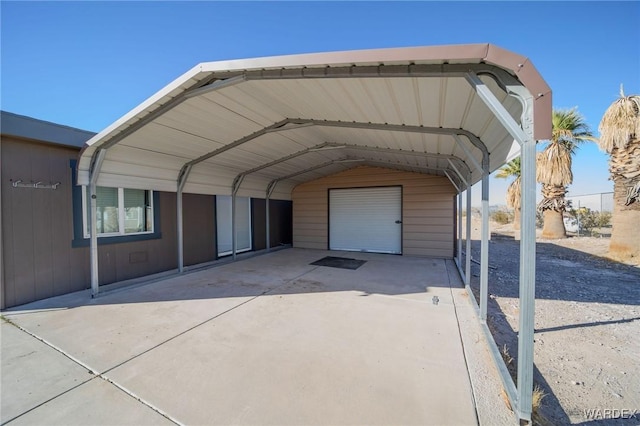 view of car parking featuring a garage and a carport