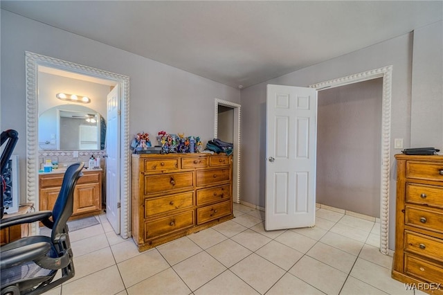 bedroom with light tile patterned floors