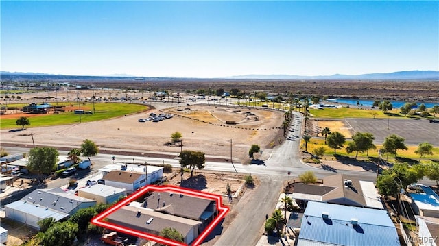 drone / aerial view featuring a residential view and a mountain view