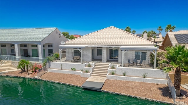 2044 E Los Lagos Dr, Fort Mohave, AZ 86426 - back of house featuring stairs, a tiled roof, and a porch