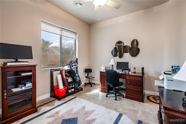 office featuring baseboards, visible vents, ceiling fan, and light tile patterned flooring