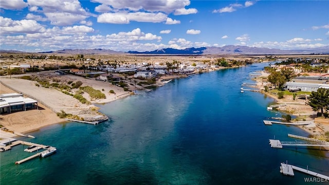 drone / aerial view with a water and mountain view