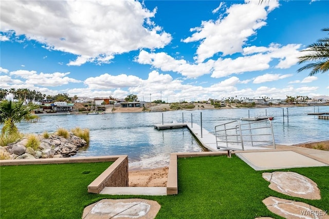 view of dock featuring a water view and a yard