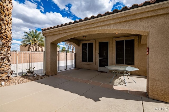 view of patio / terrace with fence and a gate