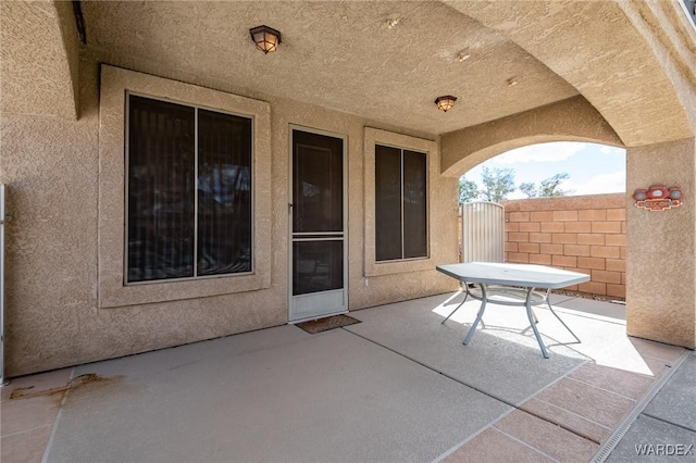 view of patio / terrace with a gate and fence