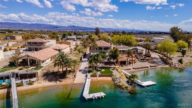 bird's eye view with a residential view and a water and mountain view