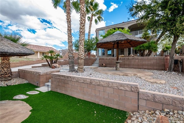 view of yard with fence and a gazebo