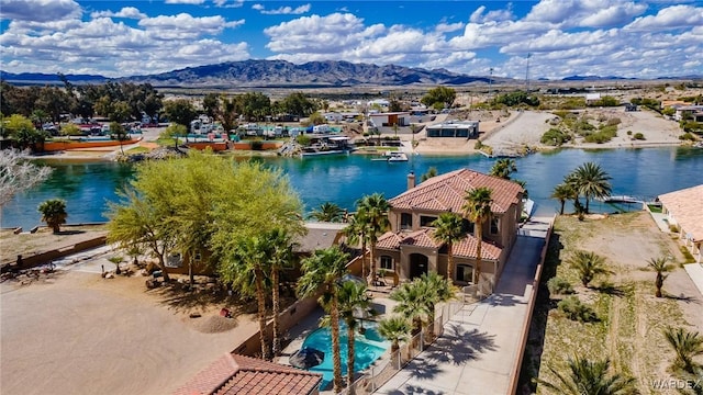 bird's eye view with a water and mountain view