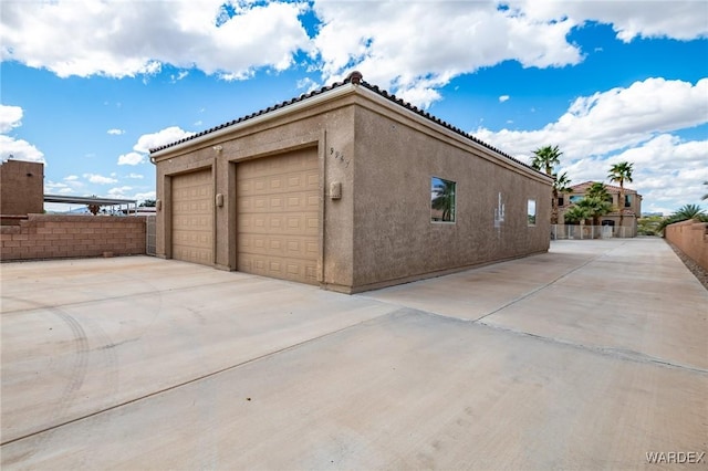 garage featuring fence