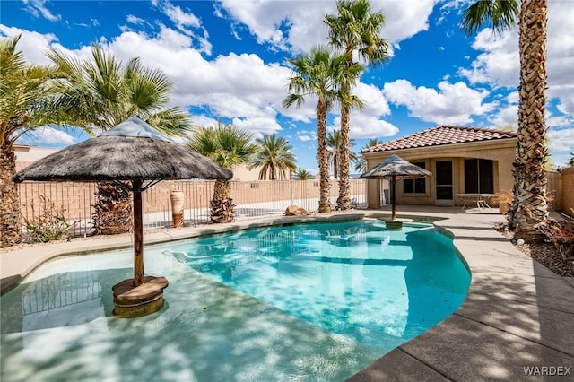 view of swimming pool with a fenced in pool, fence, and a gazebo