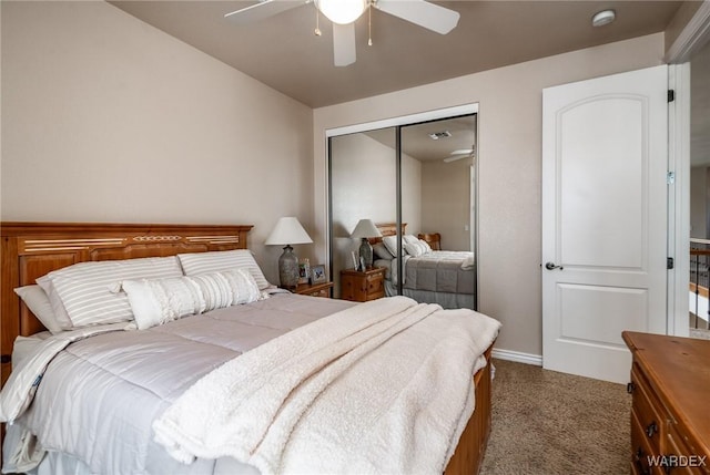 carpeted bedroom with ceiling fan, visible vents, baseboards, and a closet