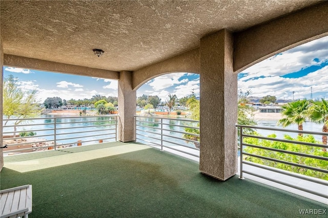 balcony featuring a water view