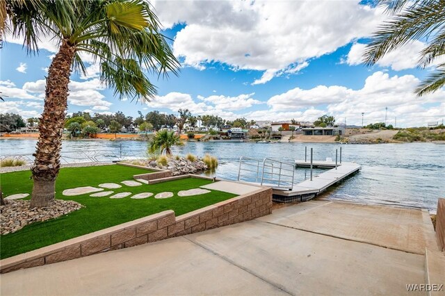 dock area featuring a water view and a yard